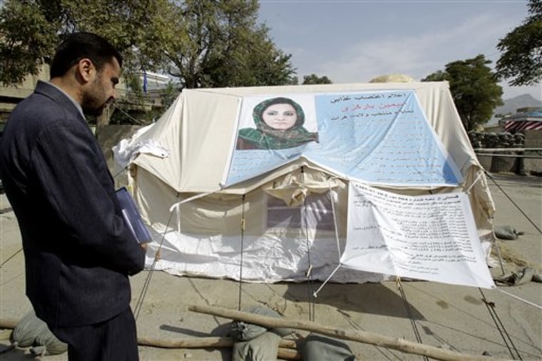 A man visits the tent of Afghan lawmaker from western Herat province, Simeen Barakzai, as she continued her fast for the eighth consecutive day in Kabul, Afghanistan, Sunday Oct. 9. Barakzai, 32, decided to go on hunger strike after she was unseated by the Independent Election Commission (IEC) in August. 